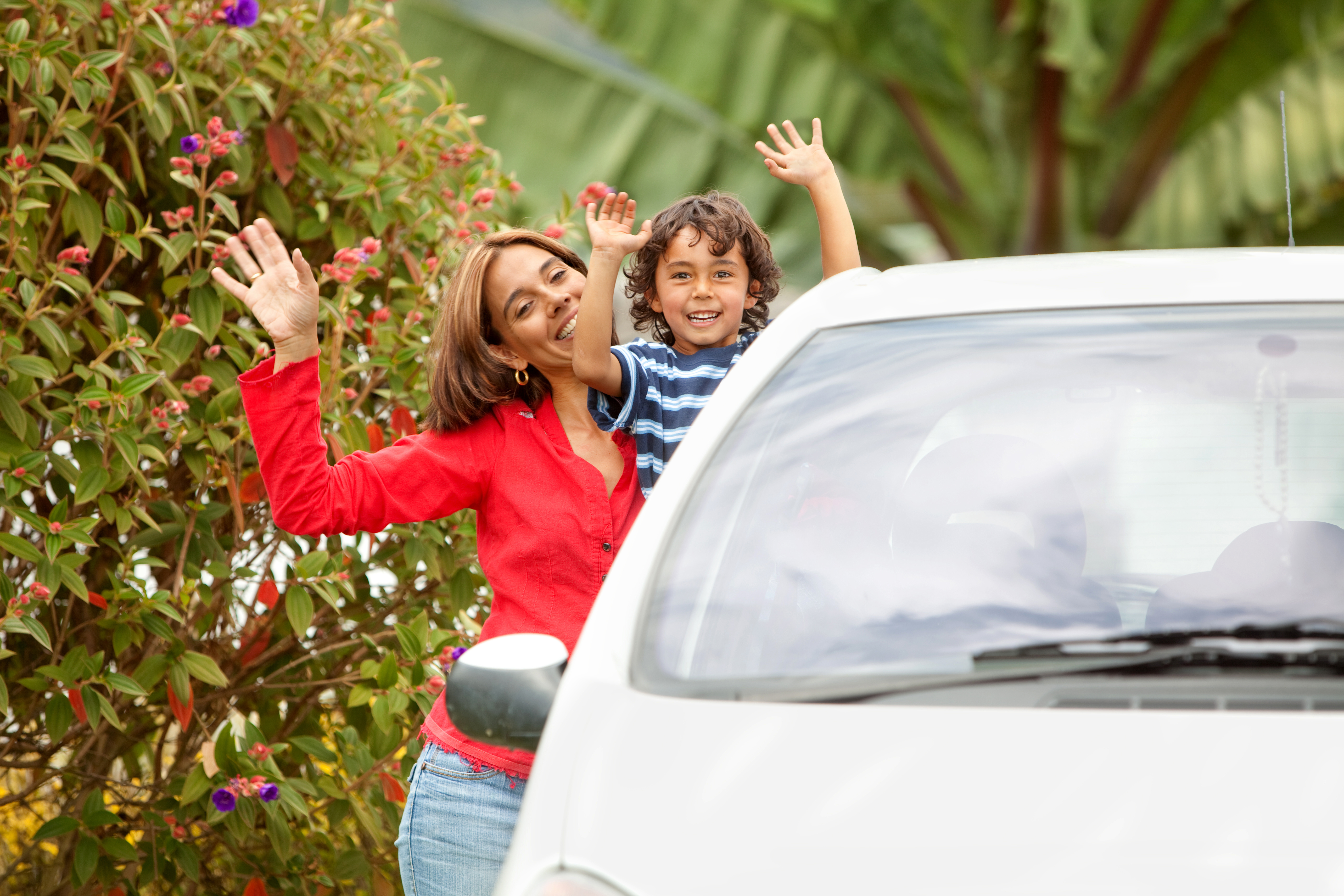 Mother and son with a car